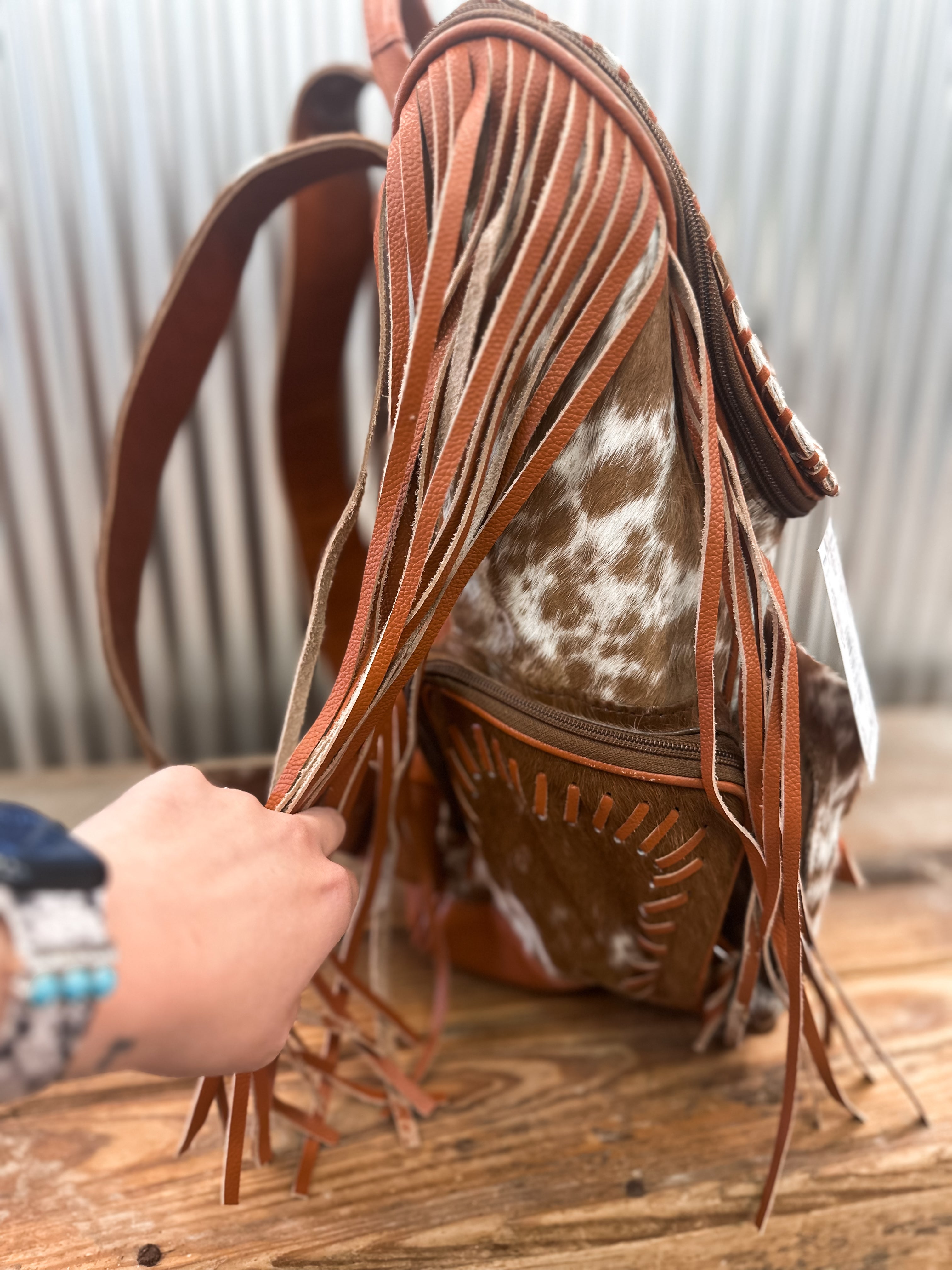 COWHIDE FRINGE BACKPACK - BROWN