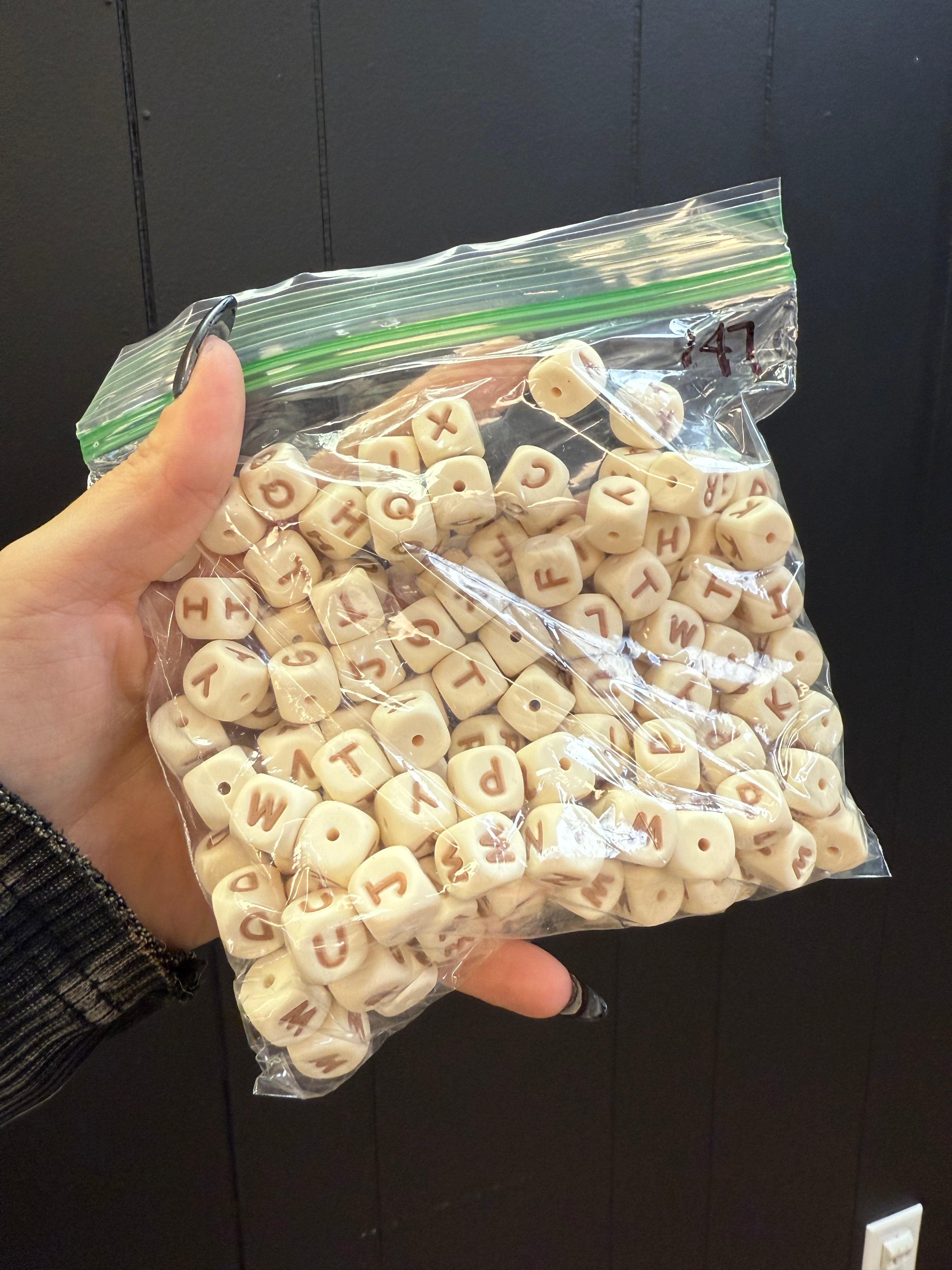 PACK OF 147 CREAM LETTER BEADS