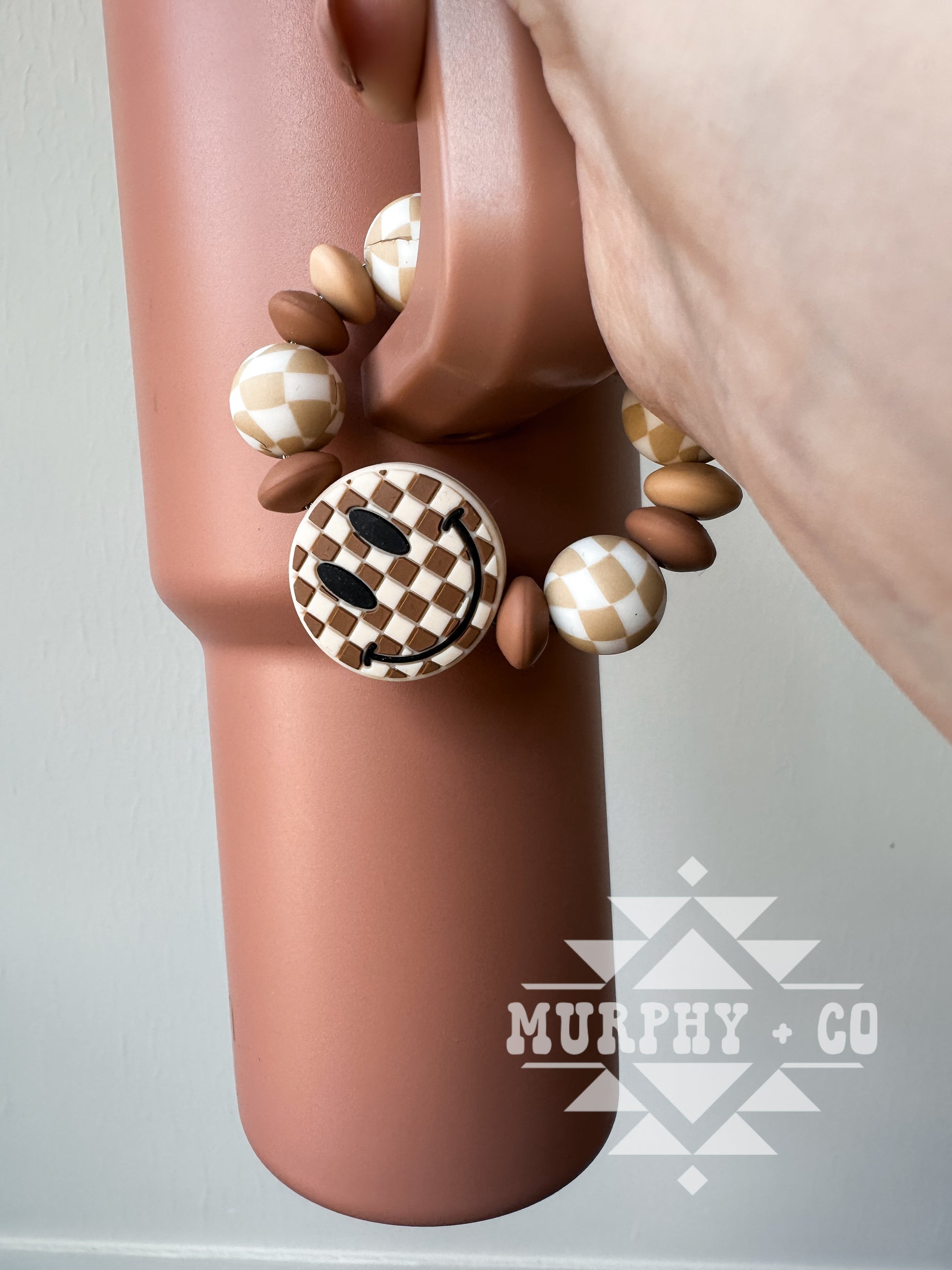 TAN CHECKER SMILEY CUP CHARM