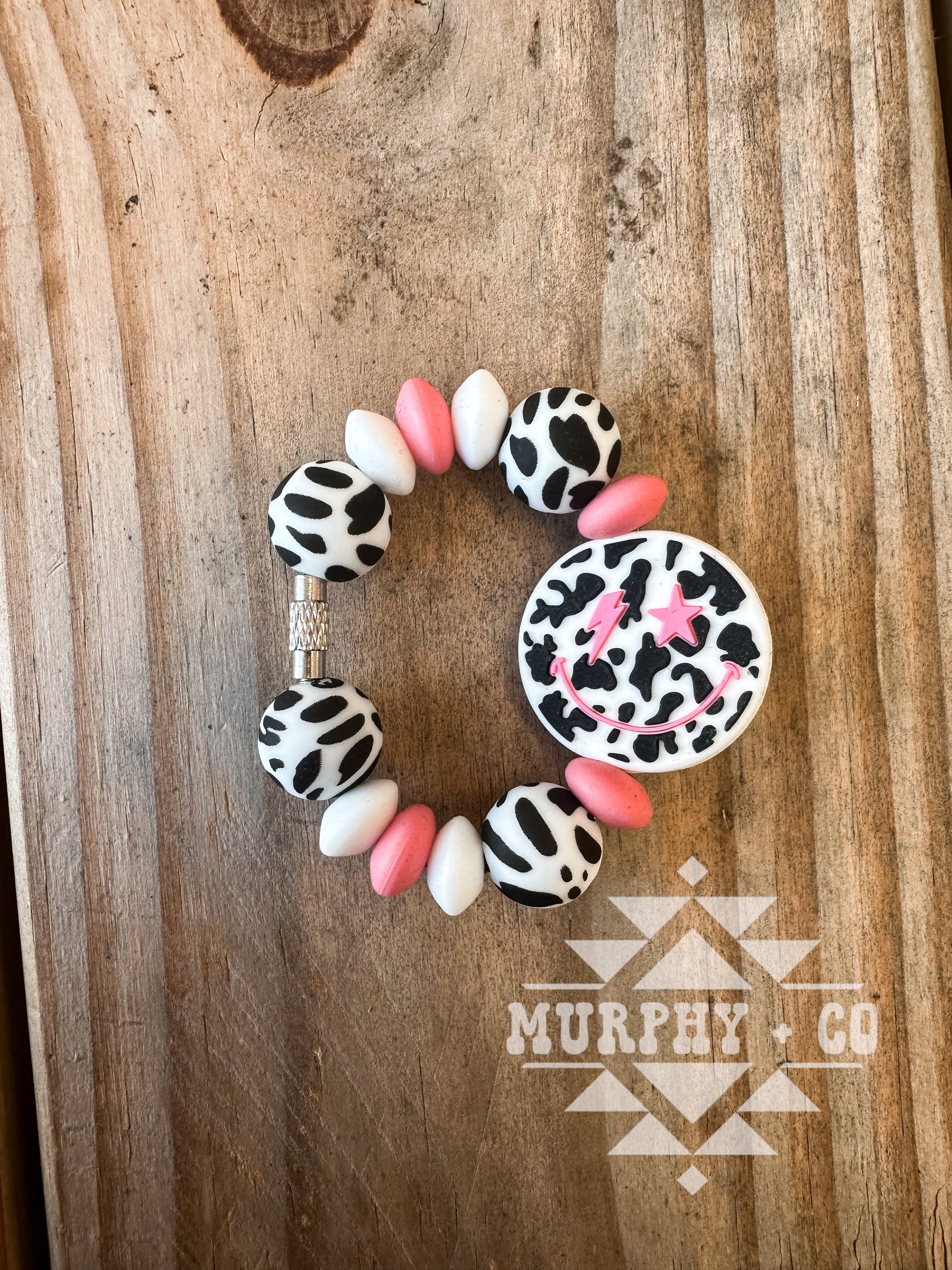 BLACK COW PRINT SMILEY CUP CHARM