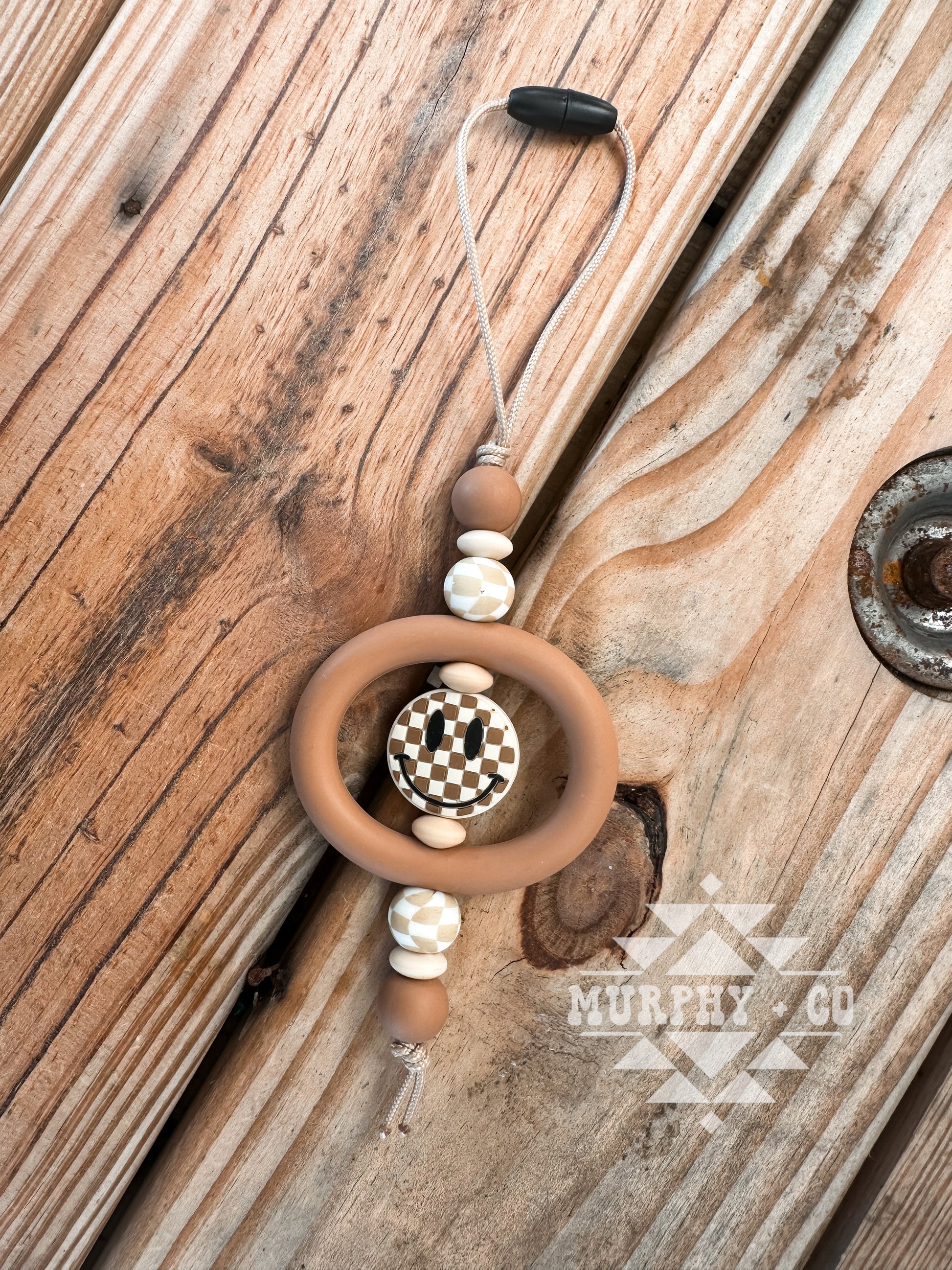 TAN SMILEY FACE CHECKER CAR CHARM