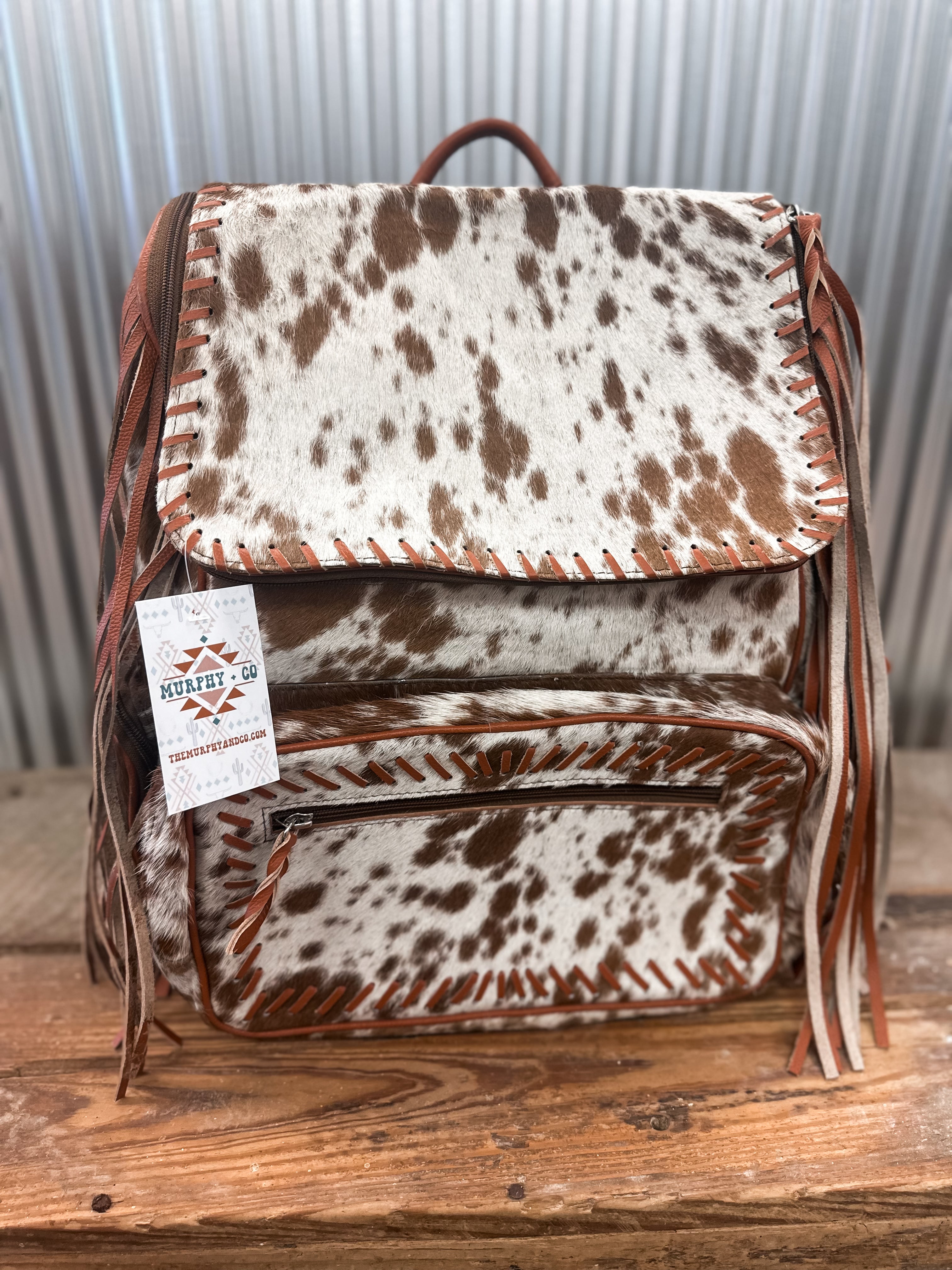 COWHIDE FRINGE BACKPACK - BROWN