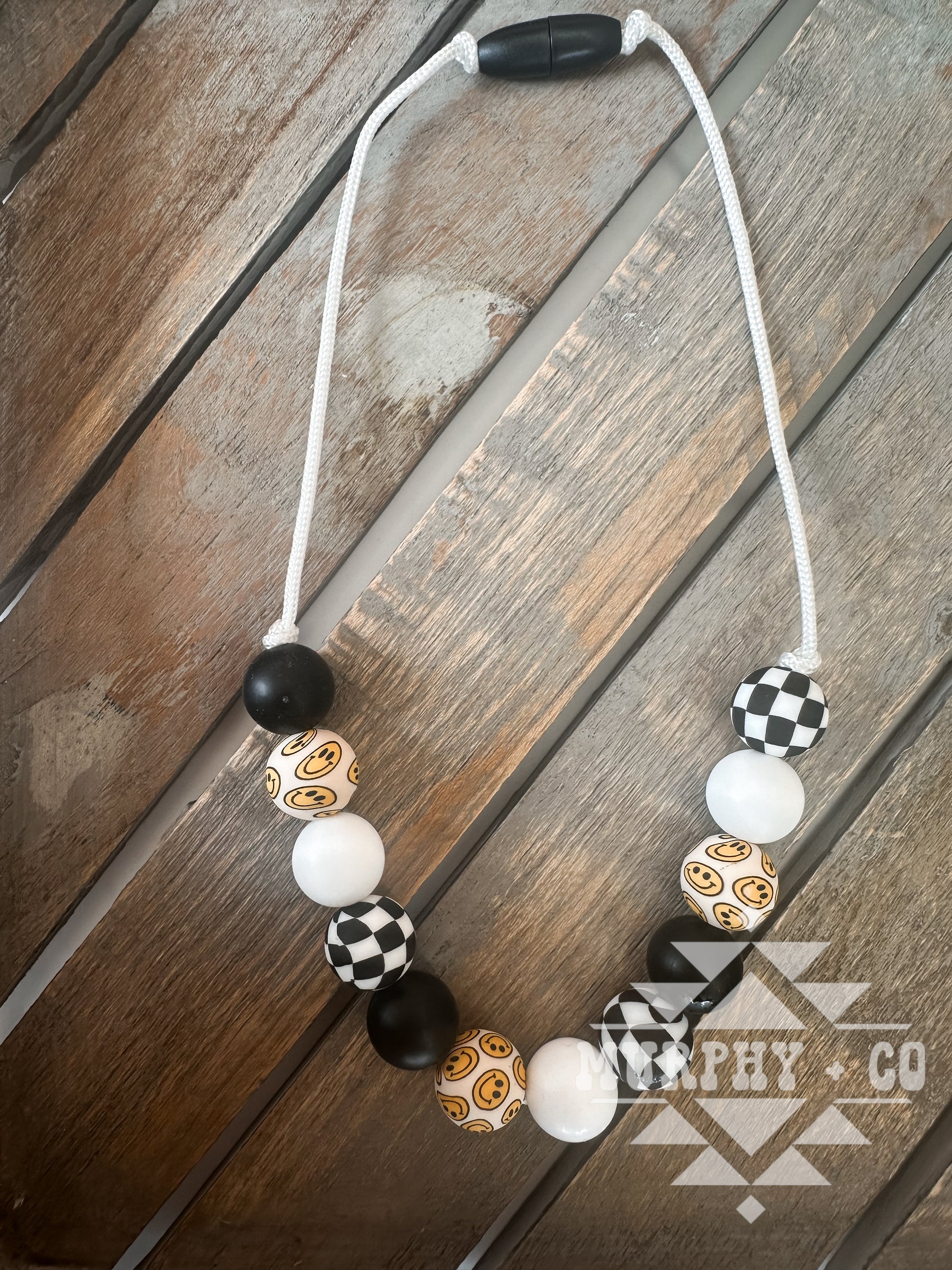 CHECKERS + SMILEYS NECKLACE