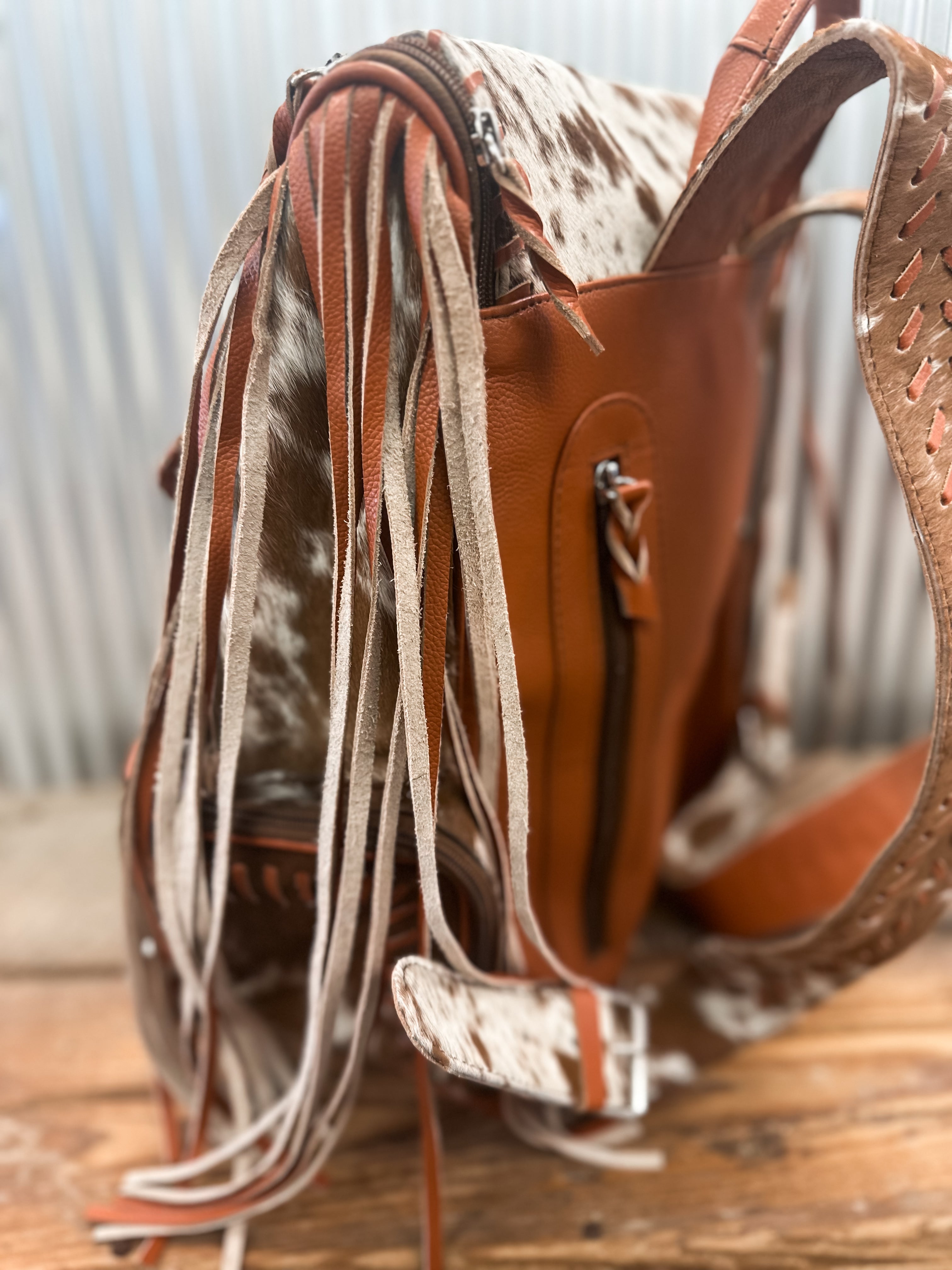 COWHIDE FRINGE BACKPACK - BROWN