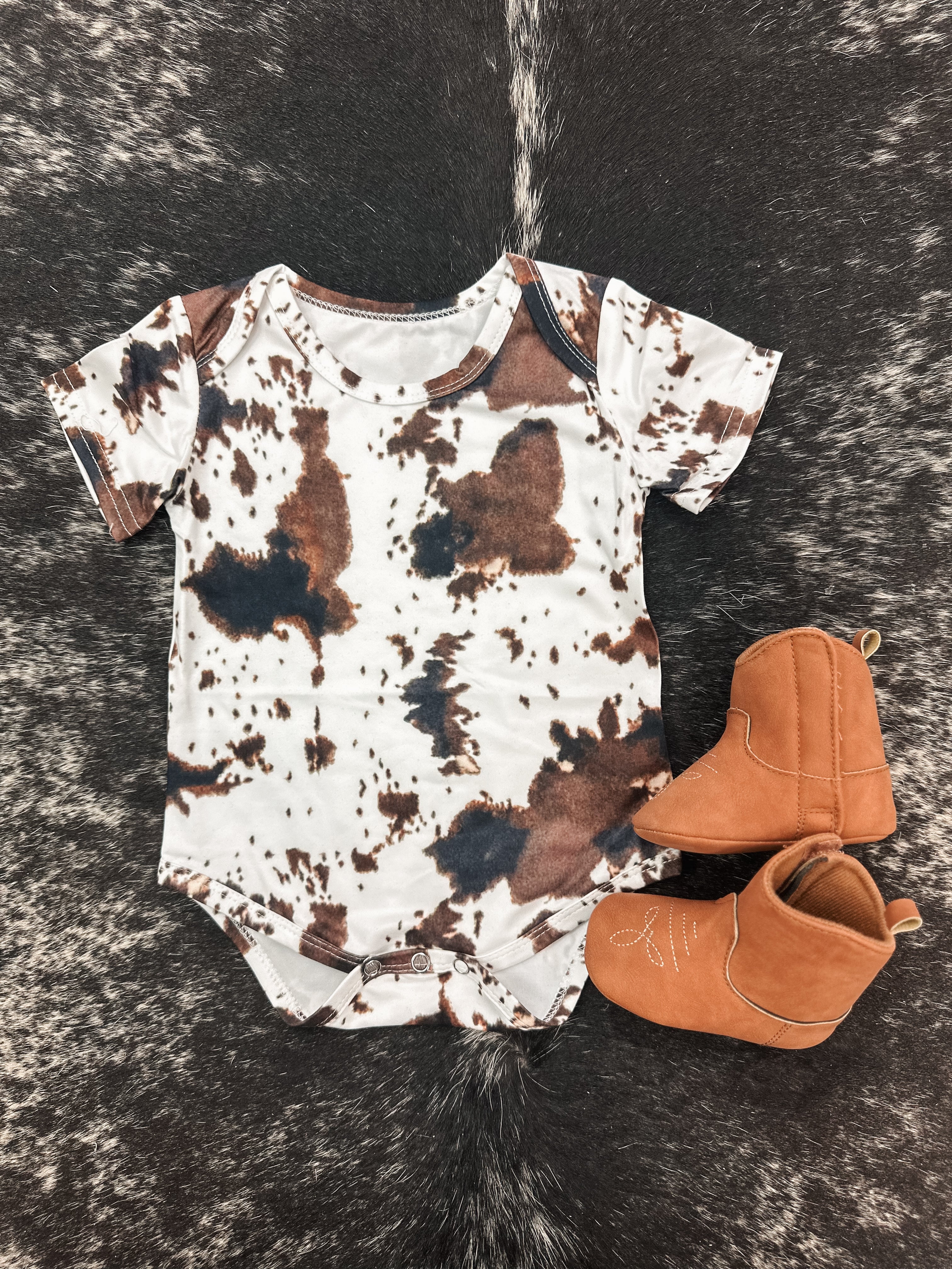 COWPRINT ONESIE
