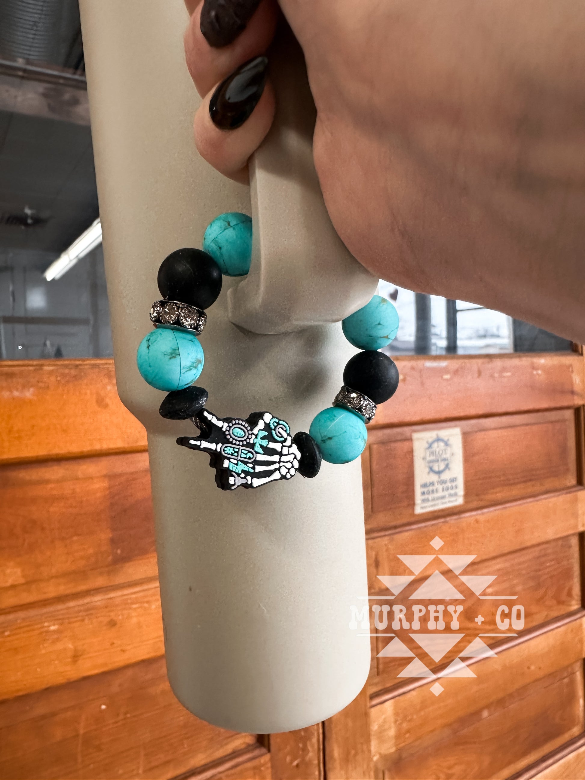 SKELLIE HAND CUP CHARM