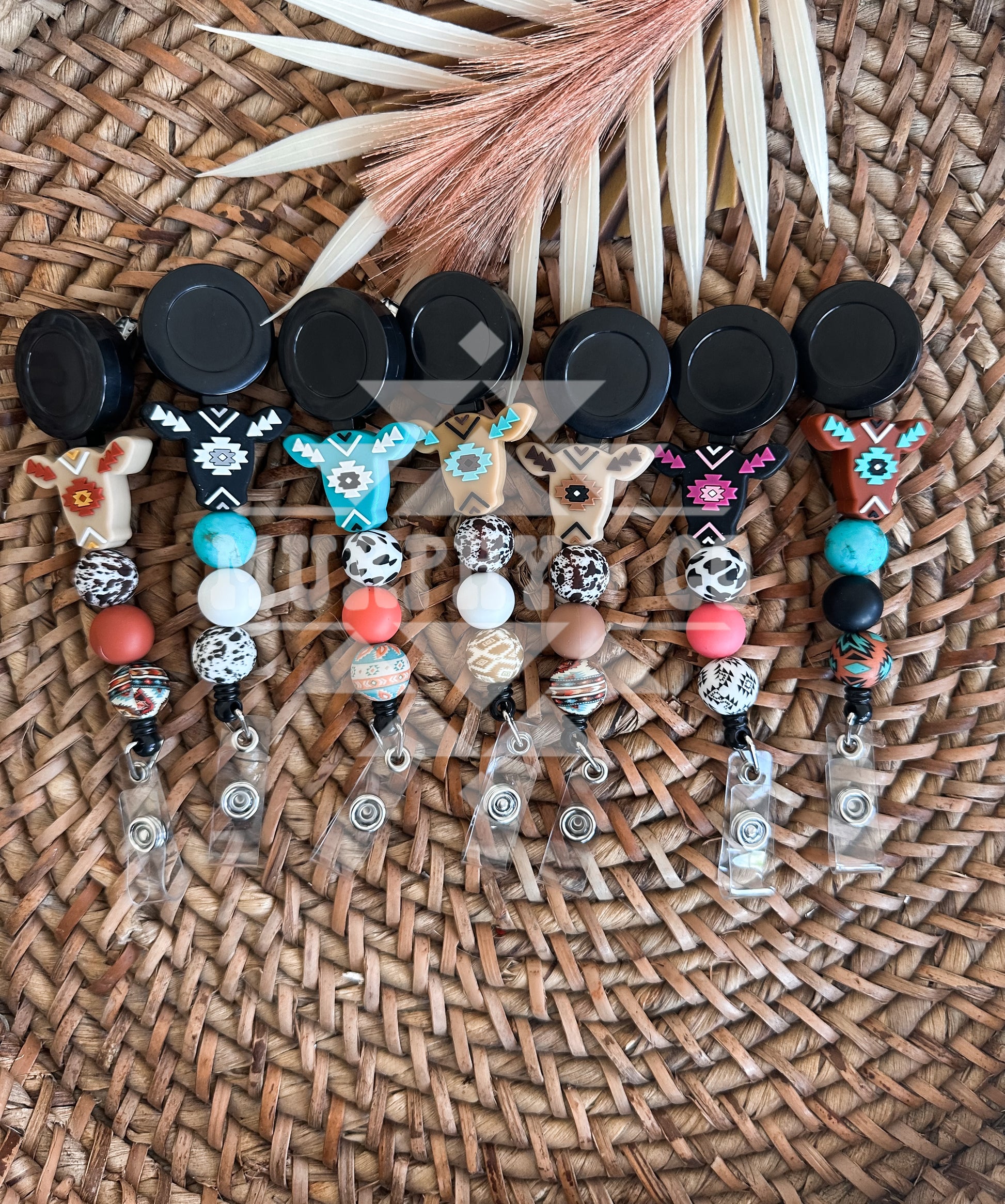 AZTEC COW BADGE REEL